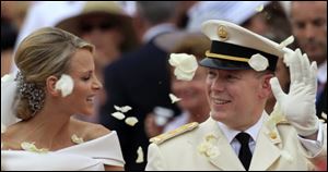 Prince Albert II of Monaco and Princess Charlene of Monaco depart from the Monaco palace after their religious wedding ceremony  Saturday. 