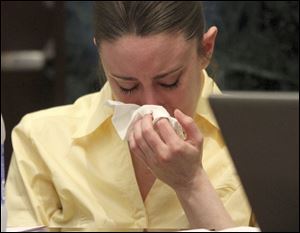 Casey Anthony reacts while listening to the state's closing arguments in her murder trial in Orlando, Fla., Sunday.