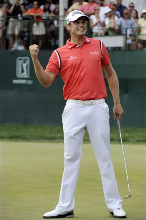 Nick Watney pumps his fist after winning the AT&T National golf tournament at Aronimink Golf Club.