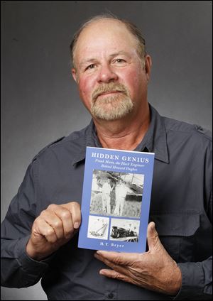 Harry Bryer with his book, ‘Hidden Genius.’