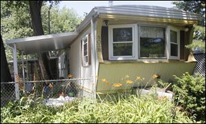 The Toledo Area Humane Society seized 22 dogs, a cat, and a bird from this trailer in Twinwall Village on Tremainsville Road, between Laskey and Alexis roads. The animals' owner does not live in the trailer.