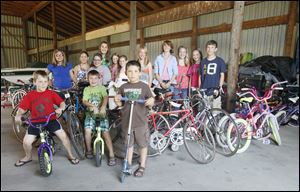 Members of the junior youth group at the Our Lady of Mount Carmel Catholic Church St. Vincent de Paul Society collected almost 100 bikes for refurbishing.