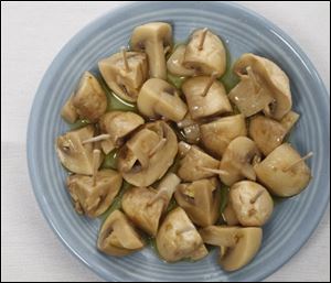 Marinated mushrooms. Many tapas and meze dishes are marinated, usually in olive oil and quite often with sherry vinegar, herbs, and garlic.