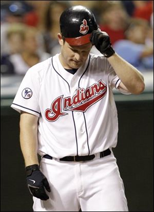 The Indians' Austin Kearns takes off his helmet after striking out against Royals starting pitcher Jeff Francis in the seventh inning.