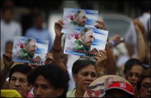 People attend a birthday celebration marking the 85th birthday of Cuba's leader Fidel Castro in Managua, Nicaragua.