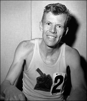 John J. Kelley sits in his dressing room in April, 1962, after finishing fourth in the Boston Marathon in Boston. Mr. Kelley, winner of the 1957 Boston Marathon and known to his fans as the first modern American road runner, has died. Amby Burfoot, a friend whom Kelley coached in high school in Groton in the early 1960s, confirmed his death.He was 80.