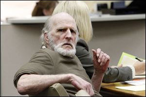 Robert Bowman appears in Lucas County Common Pleas Court with Attorney Jane Roman last week.