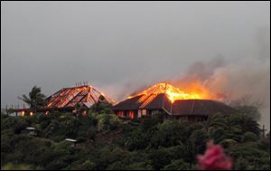 British entrepreneur's Sir Richard Branson's luxury home, on Necker Island in the Caribbean, burns. Guests including Academy Award-winning actress Kate Winslet escaped uninjured when fire destroyed Richard Branson's Caribbean home during a tropical storm Monday, said the British businessman. The Virgin Group boss said about 20 people, including Winslet and her children, were staying in the eight-bedroom Great House on Necker, his private isle in the British Virgin Islands.