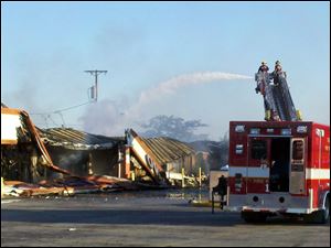 Firefighters douse a 