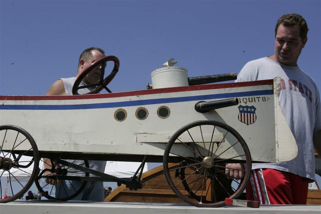 Pat-Waldvogel-Joe-Waldvogel-look-at-Mosquito-gun-boat