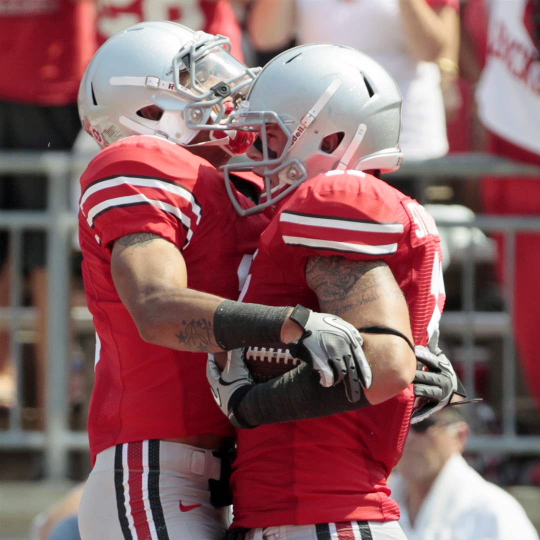 Ohio-State-Jake-Stoneburner-celebrates-with-Verlon-Reed