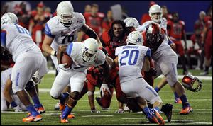 Boise State running back D.J. Harper bulls his way for a seven-yard gain against the University of Georgia in a game Sept. 3 at the Georgia Dome in Atlanta. Harper carried eight times for 44 yards, scoring a TD.