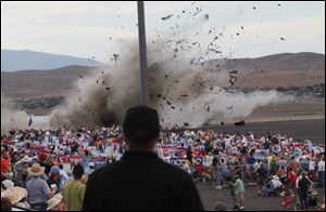 A P-51 Mustang airplane crashes into the edge of the grandstands at the Reno Air show Friday.