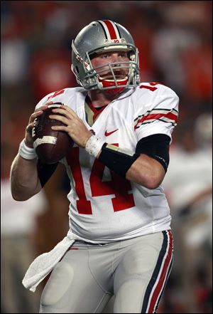 Ohio State quarterback Joe Bauserman drops back to pass during the first quarter of an NCAA college football game against Miami, Saturday, Sept. 17, 2011, in Miami.