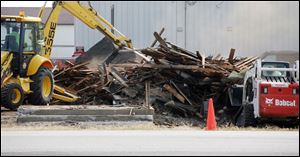 To save money, the demolition of the nearly century-old structure was done by Perrysburg Township employees rather than by an outside company.