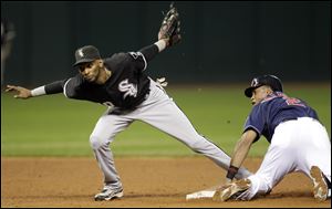 Cleveland Indians' Luis Valbuena, right, slides safely into second base on a steal as Chicago White Sox shortstop Alexei Ramirez can't make the play during the sixth inning in the second baseball game of a doubleheader, Tuesday, Sept. 20, 2011, in Cleveland. 