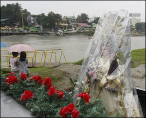 The image of Our Lady of the Abandoned is repared for a procession to a Catholic church at Marikina city, Philippines during a ceremony to commemorate the wrath of typhoon Ketsana which caused the worst flooding in decades and killed more than 500 people exactly two years ago Monday. The Philippines braced for a new typhoon, Nesat, which made landfall at dawn.