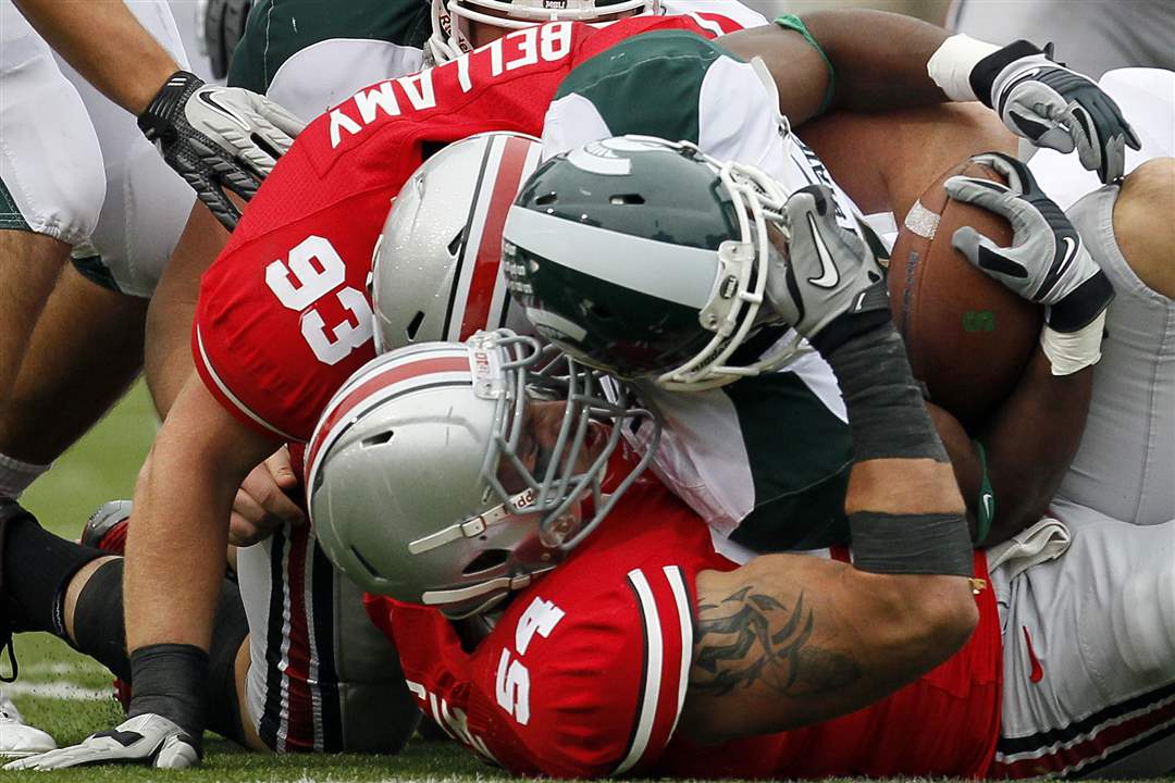 Ohio-State-DT-John-Simon-stops-MSU-RB-Edwin-Baker