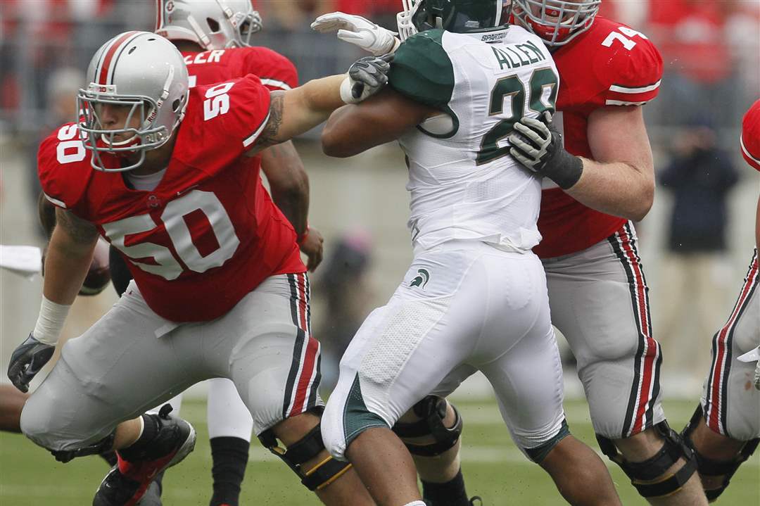 Ohio-State-left-guard-Jack-Mewhort-blocks-MSU-OLB-Denicos-Allen