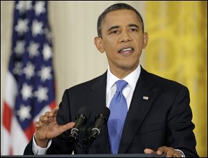 President Barack Obama speaks during a news conference Thursday in the East Room of the White House.