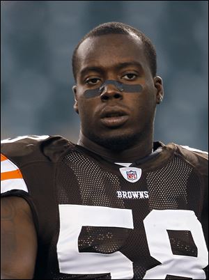 In this Aug. 25, 2011, photo, Cleveland Browns linebacker Marcus Benard waits for the Browns' preseason NFL football game with Philadelphia Eagles in Philadelphia. Benard broke his arm in a motorcycle accident shortly after leaving the team's first practice Monday, Oct. 10, 2011, following their bye week.