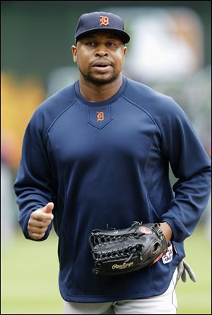 Detroit's Delmon Young jogs onto the field before Game 2 of the ALCS on Monday. A muscle injury kept him out of Game 3 last night.