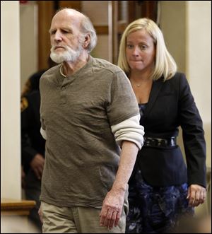 Robert Bowman, followed by attorney Jane Roman, enters Lucas County Common Pleas Court in Toledo, for the start of jury selection in his retrial, Tuesday, October 11, 2011, He is accused of killing of 14-year-old Eileen Adams in 1967.