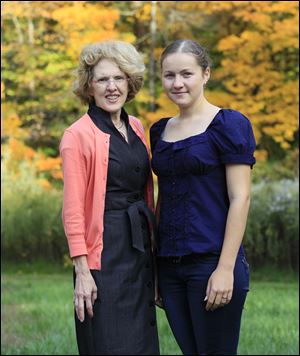 Valeria Bujac, a girl from Moldova who is spending the school year at Bedford High School, with her host family Teresa Arnold, left, and her husband Ken, not pictured.