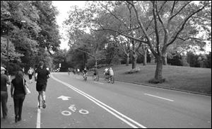 Bikers and walkers head up Cedar Hill.