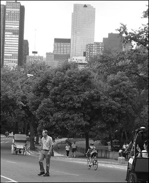 Bike riders, walkers, and pedicabs are among those enjoying the southern end of Central Park.