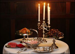 A table is set with candles, dates and other sweets during the Hancock Historical Museum's Christmas Victorian dinner.