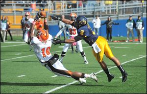 Bowling Green #19, Kamar Jorden vs. Kent #2, Josh Pleasant, second quarter.   
Bowling Green's Kamar Jorden, 19, stretches for a catch, against Kent State's Josh Pleasant.