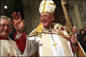 The Most Rev. Timothy Dolan greets worshippers in St. Patrick's Cathedral in New York during his installation as the new archbishop in 2009. Catholic journalist and author John L. Allen is to release a book of interviews with the archbishop, 'A People of Hope.'