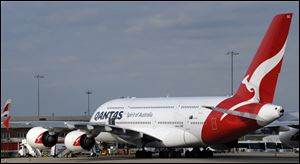 A Qantas Airbus A380 sit on the tarmac Saturday at Heathrow Airport, London, after Qantas Airways grounded its global fleet indefinitely after weeks of disruptive strikes. 