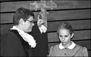 Abigail Williams (Savannah Stark, right) is reminded by Deputy Gov. Danforth (Roland Scaife) that she is under oath during the 1692 Salem witch trials in a scene from the Ritz Teen Thespian Guild production of 'The Crucible.'