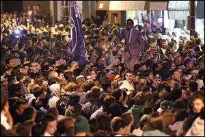 Penn State students and others gather off campus Wednesday in State College, Pa., following the firing of football coach Joe Paterno and university president Graham Spanier amid the growing furor over how the school handled sex abuse allegations against an assistant coach.