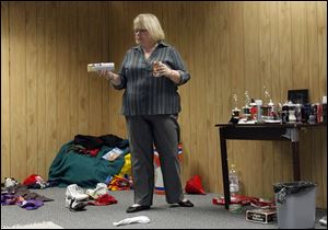 Carrie Arndt uses the 'Teen Bedroom Display' to teach parents where to look for signs of teens at risk.