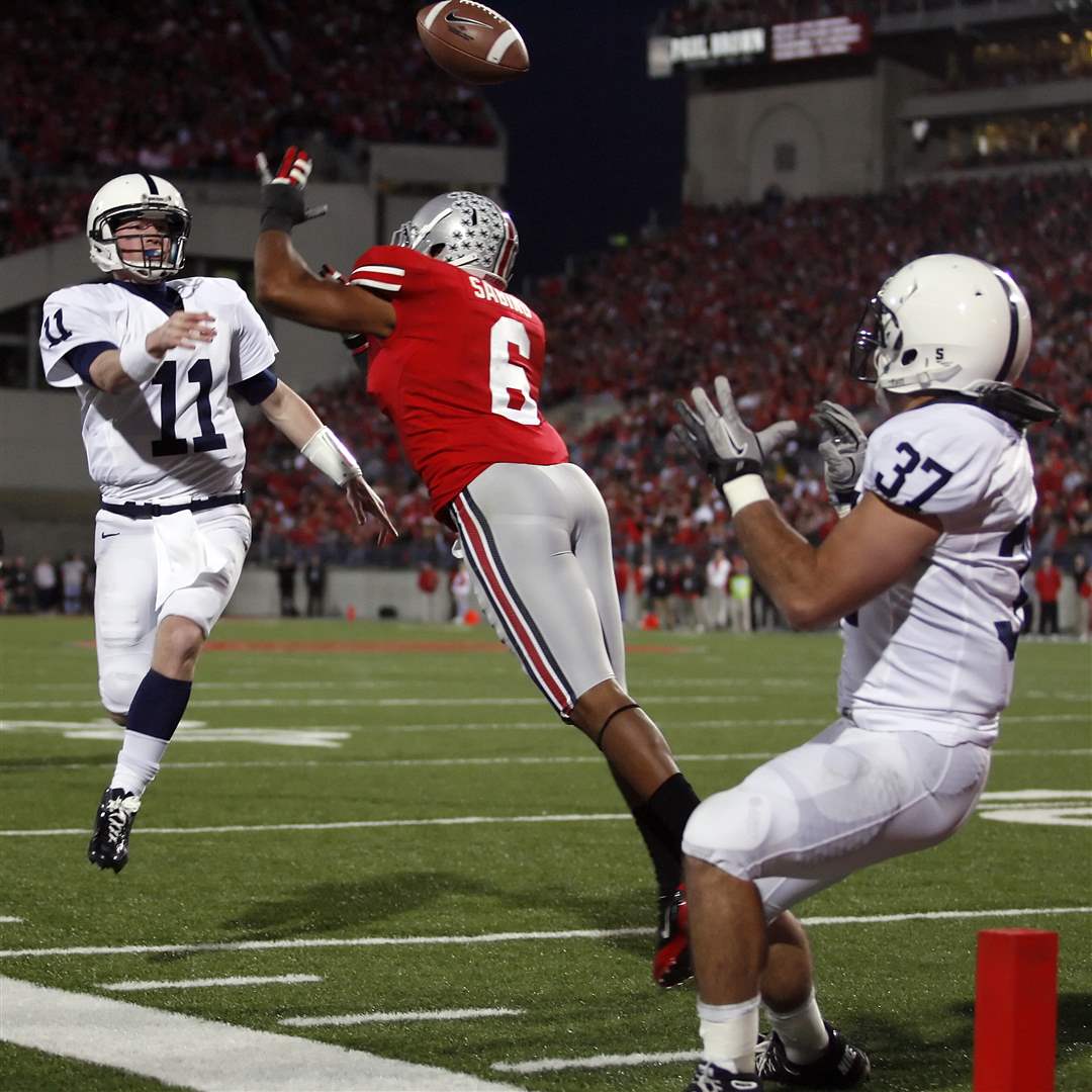 Penn-State-quarterback-Matt-McGloin-lobs-a-pass-over-OSU-s-Etienne-Sabino