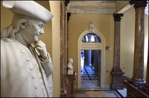 A statue of Benjamin Franklin graces empty corridors in Congress Sunday at the U.S. Capitol in Washington. Lawmakers on both sides of the special deficit-cutting committee talks stressed Friday that they were ready to meet through the weekend in a last-ditch search for compromise. On Sunday talk shows some blamed each other for the intransigence that has gridlocked the panel in its quest to cut the deficit by at least $1.2 trillion over the coming decade.