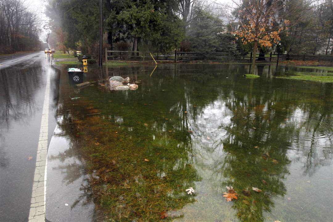 Recyclables-wait-to-be-collected-in-soupy-conditions-on-Corey-Street