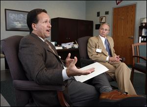 Paramount President John  'Jack'  Randolph, left, with the firm's vice president for marketing, Mark Moser, says his company has a strong relationship with doctors, who help with operational and policy decisions.  'It doesn’t mean we don’t . . . have issues that come up,'  Mr. Randolph says.