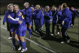 St. Ursula celebrates a victory over Cuyahoga Falls Walsh Jesuit in a Division II state semifinal in Tiffin. The Arrows finished with a 15-7-1 record.