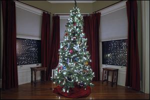 A decorated tree in a bedroom of the home of Bruce and Mary Bennett.