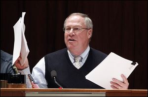 Councilman D. Michael Collins questions the administration during a Toledo City Council Committee of the Whole.