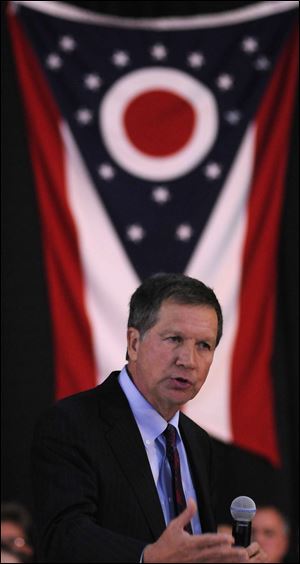 Gov. John Kasich reads news on electronic gadgets, a spokesman says.