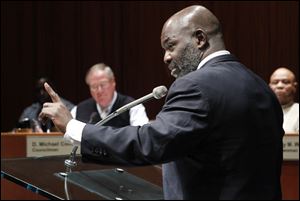 Toledo Mayor Mike Bell fields questions during a City Council committee hearing. He said Wednesday that the changes being proposed do not necessarily mean that wrongdoing has occurred. 