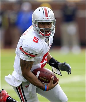 Ohio State's Braxton Miller threw for 997 yards and rushed for 695 yards in the regular season.