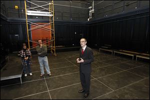 Simon Morgan-Russell, dean of BGSU College of Arts and Sciences, explains the modern features inside the Eva Marie Saint Theater.