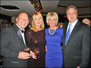 Enjoying themselves at Stone Oak Country Club’s 20th Annual Lighting of the Lights Gala were Greg Meyers, Lori Moffitt, Terri Schmakel, and Jeff Dykas.