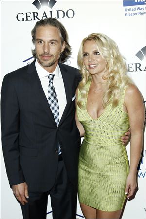 Singer Britney Spears, right, and Jason Trawick are engaged according to 'Access Hollywood.'